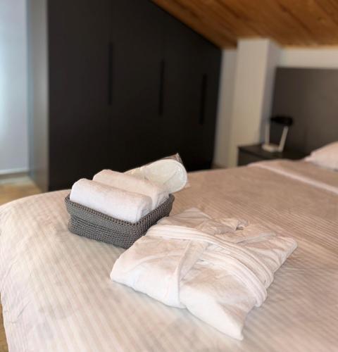 a pair of towels sitting on top of a bed at RestList in Haghpat