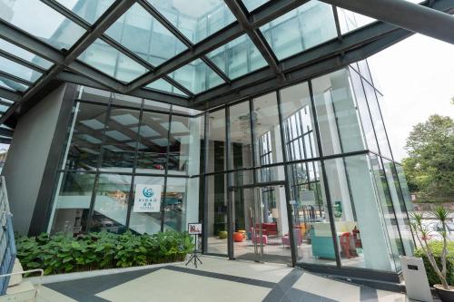 an office building with glass doors and windows at Kingston Hotel 22 - Cheras, Kuala Lumpur in Kuala Lumpur