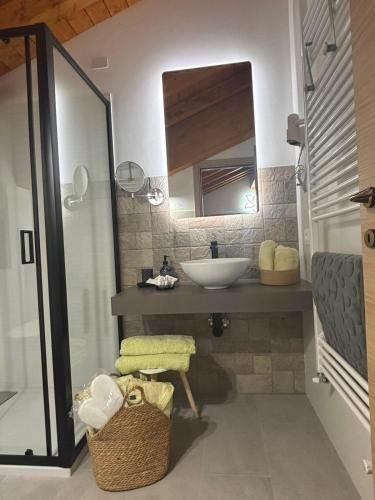 a bathroom with a sink and a mirror at Mondo D'Oro in Macugnaga