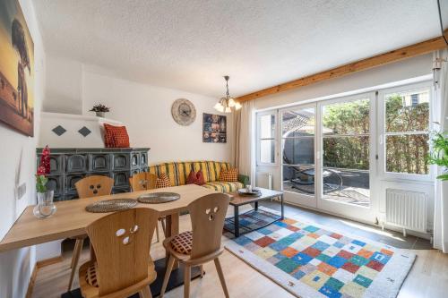 a living room with a table and a couch at LIDA CHALET in Längenfeld