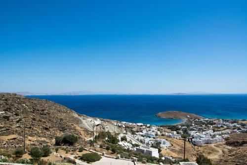 a view of a city and the ocean at Villa Anemelia Tinos in Agios Ioannis