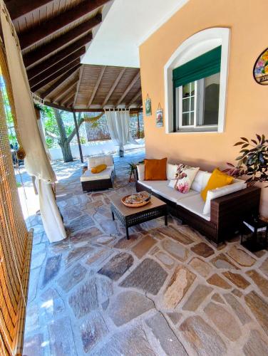 a living room with a couch and a table at Joanna Studio in Akamatra