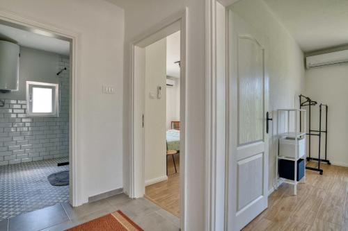 a hallway with a door leading to a room at Calm apartment in Lepetane in Tivat
