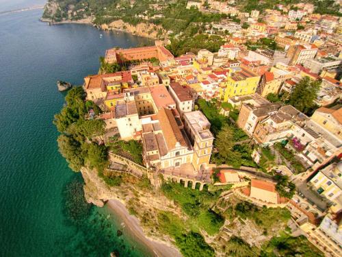 an aerial view of a town on the edge of the water at Villa Emma Exclusive in the Historic Center-Sorrento Coast in Vico Equense