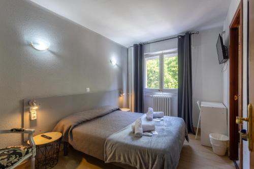 Postel nebo postele na pokoji v ubytování Siracusa