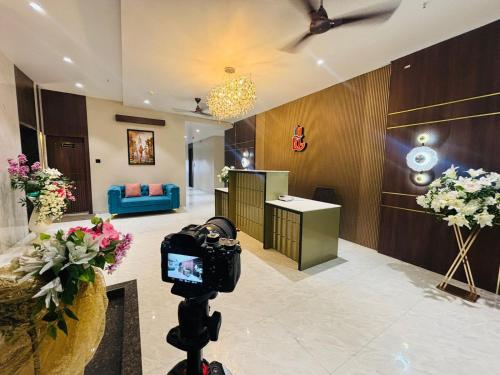 a camera on a tripod in a hotel lobby at The Grand Dularia in Nagpur