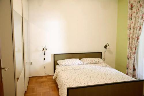 Postel nebo postele na pokoji v ubytování Apartment Ema