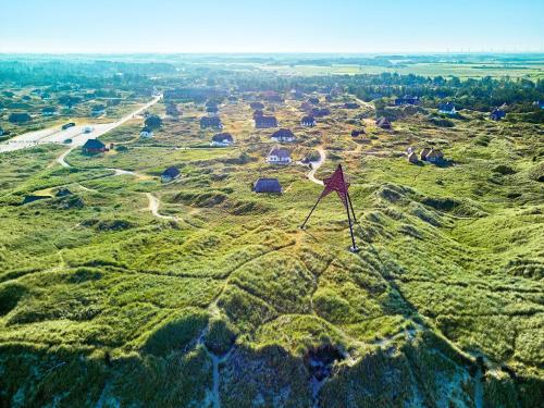 an aerial view of a field with houses on a hill at Vedersø Holiday Center in Ulfborg