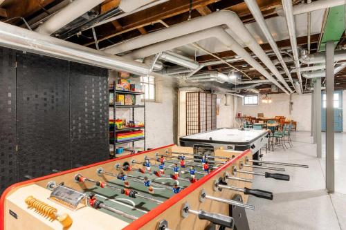 a ping pong table in a room with a ping pong ball at Historic 2BR with Deck Games & Garage in Saint Louis