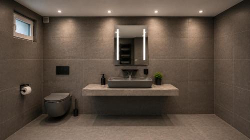 a bathroom with a sink and a toilet and a mirror at Köln Pulheim Wellness Oase in Pulheim