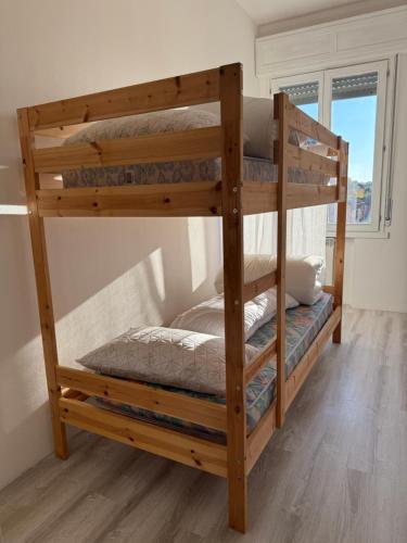 a couple of bunk beds in a room at We4 apartment Maranello in Maranello