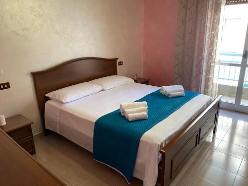 a bedroom with a bed with two pillows on it at Casetta in Centro in San Salvo