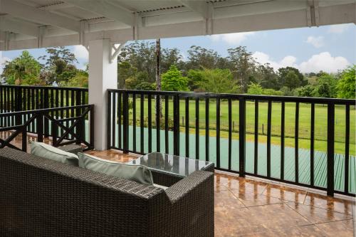 a balcony with a view of a body of water at Protea Hotel by Marriott George King George in George