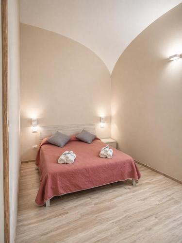 a bedroom with a bed with two towels on it at Da Nonna Iolanda in Caiazzo