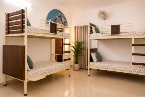 a room with bunk beds in a house at Hotel Atithya in Udaipur