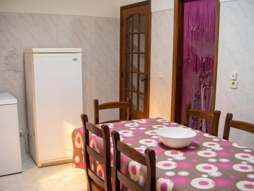 a dining room with a table with a bowl on it at Sea View Apartment in Peniche in Peniche