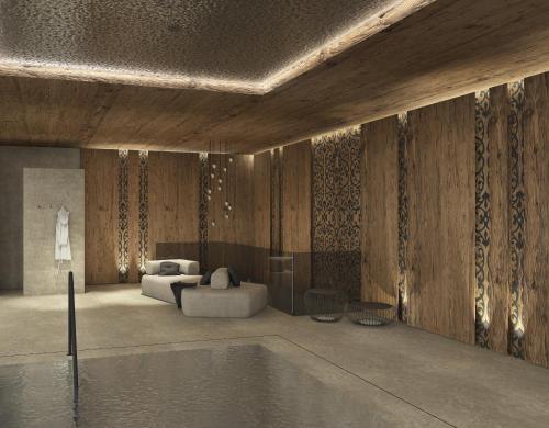 a rendering of a living room with a pool at Hotel Dorfer Alpine&Charming in Selva di Val Gardena