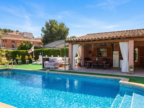 a pool with a gazebo and a house at Appartement avec piscine partagée à Roquefort-la-Bédoule - 50m² in Roquefort-la-Bédoule