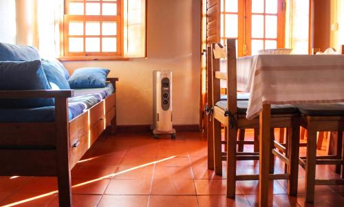 a room with a couch and an air conditioner at Comfortable Apartment in Seia with Terrace and Fireplace in Seia