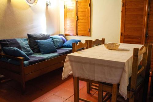 a living room with a couch and a table at Comfortable Apartment in Seia with Terrace and Fireplace in Seia