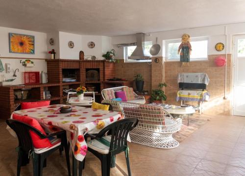 a living room with a table and chairs at Charming Apartment in Sintra with Pool in Sintra