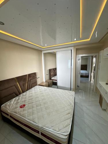 a bedroom with a large bed in a room at luxury apartament golf the beach capuchino in Cabo Negro