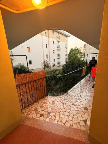 a view of a balcony with a building in the background at Twin room in Nice
