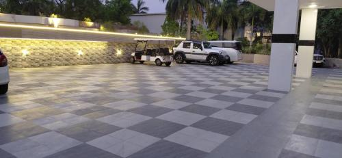 a golf cart parked in a parking lot at Landmark Resort in Sonīpat