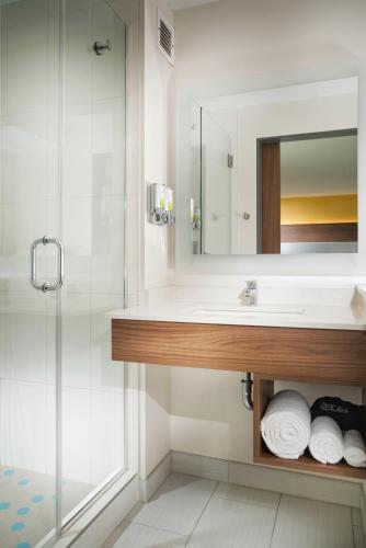 a bathroom with a sink and a shower at Staypineapple, Hotel Z, Gaslamp San Diego in San Diego