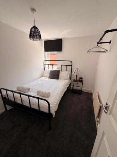 a bedroom with a bed and a flat screen tv at Alexandra View in Goole