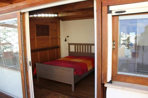 a small bedroom with a bed inside of a house at Romantic Studio Apartment Near Park in Rome