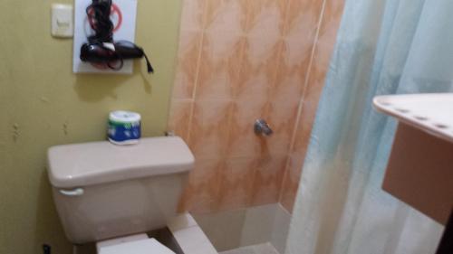 a bathroom with a toilet and a shower at B&B KeisyAlba Punta Rucia in Punta Rucia