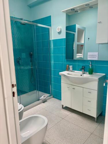 a bathroom with a toilet and a sink and a shower at To Be Capri Sea view Rooms in Capri