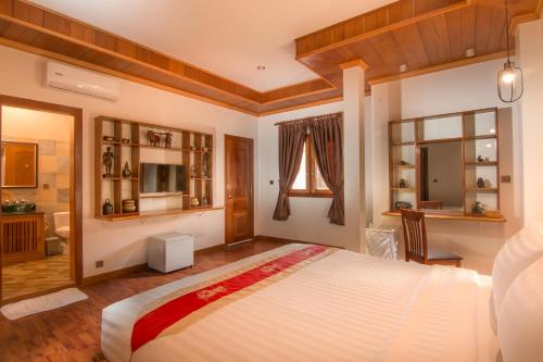 Postel nebo postele na pokoji v ubytování BB Angkor Residence