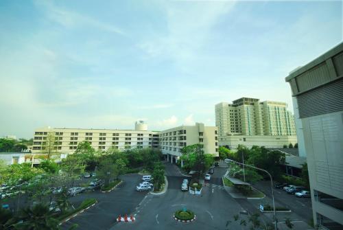 an aerial view of a parking lot in a city at Rama Gardens Hotel Bangkok in Bangkok