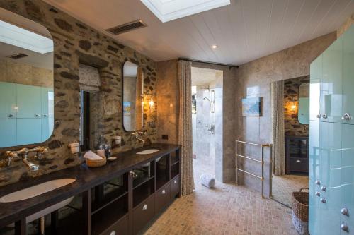 a bathroom with two sinks and a shower at Mahu Whenua in Wanaka