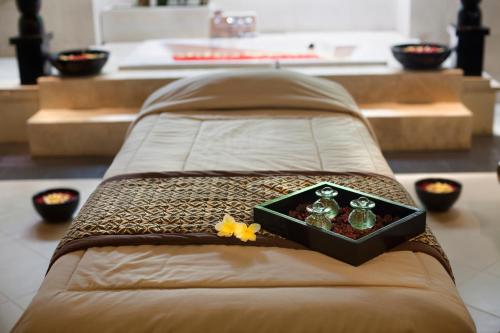 a bed with a box on top of it at Puri Santrian Beach Resort And Spa in Sanur