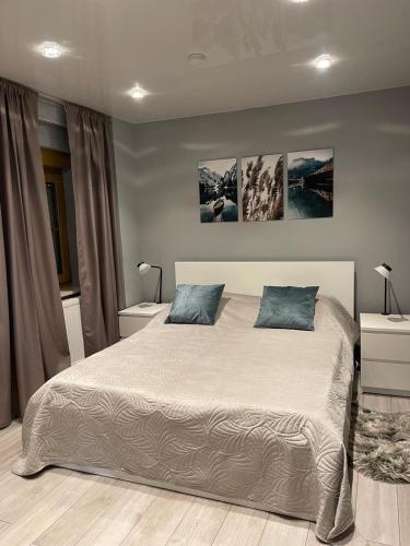 a bedroom with a large bed with two pillows at Ferienwohnung Liliana in Dannenfels