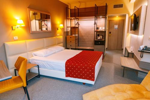 a bedroom with a large bed in a room at Best Lido Hotel in Timişoara
