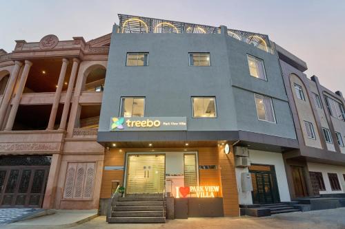 a building with a sign on the front of it at Treebo Park View Villa in Jodhpur