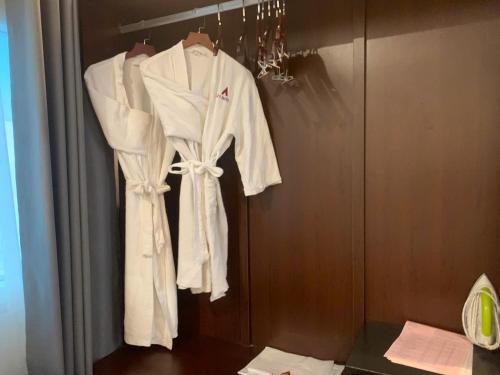 a robe hanging on a wall in a room at A25 Hotel - 57 Quang Trung in Hanoi