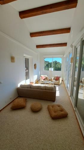a living room with a couch and a table at La Villa Blateiras in Générargues