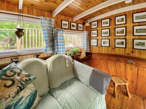a living room with a couch and a window at The Prince - Uk42204 in Clachan of Glendaruel