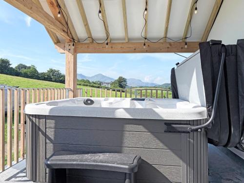 a bath tub sitting under a gazebo at Little Knott in High Nibthwaite