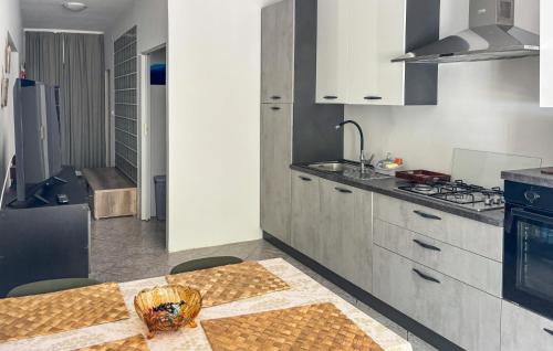 a kitchen with a table with a bowl on it at Nice Home In Karlobag With Wifi in Karlobag