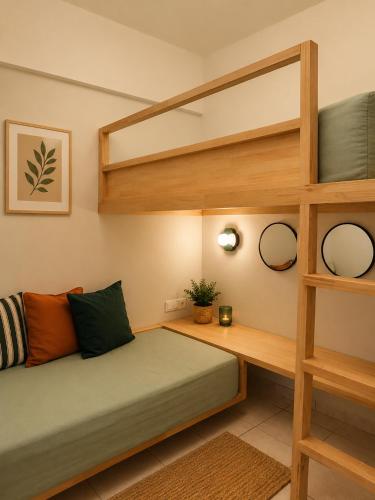 a bedroom with a bunk bed and a desk at Noéma Mani Boutique Residences in Gythio