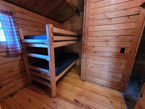 a room with a bunk bed in a sauna at Baraboo RV Resort in Baraboo