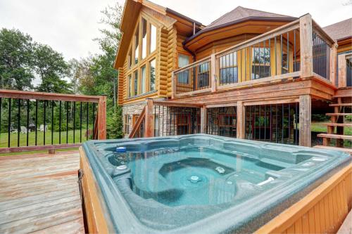 a house with a large pool in front of it at Spa Pool & Sauna - Laurentides Serenity in Mille-Isles