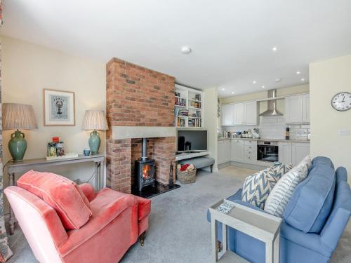 a living room with a couch and a fireplace at Nightfold - Uk49890 in Preston