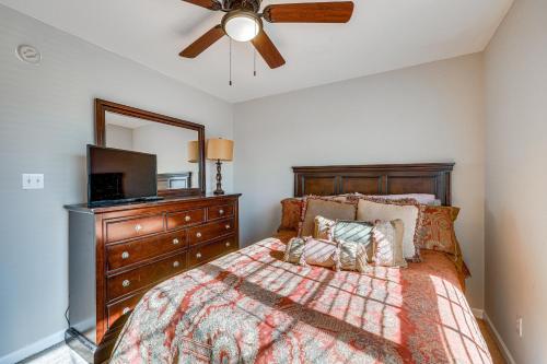 a bedroom with a bed with a ceiling fan and a mirror at Birmingham Haven New Deck King Bed No Cleaning Fee in Birmingham